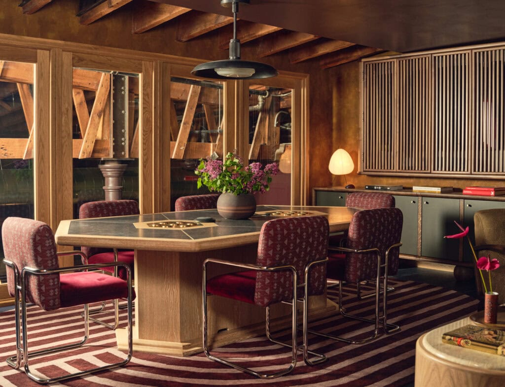 Private meeting space with velvet chairs and floral centerpiece at The Malin Flatiron